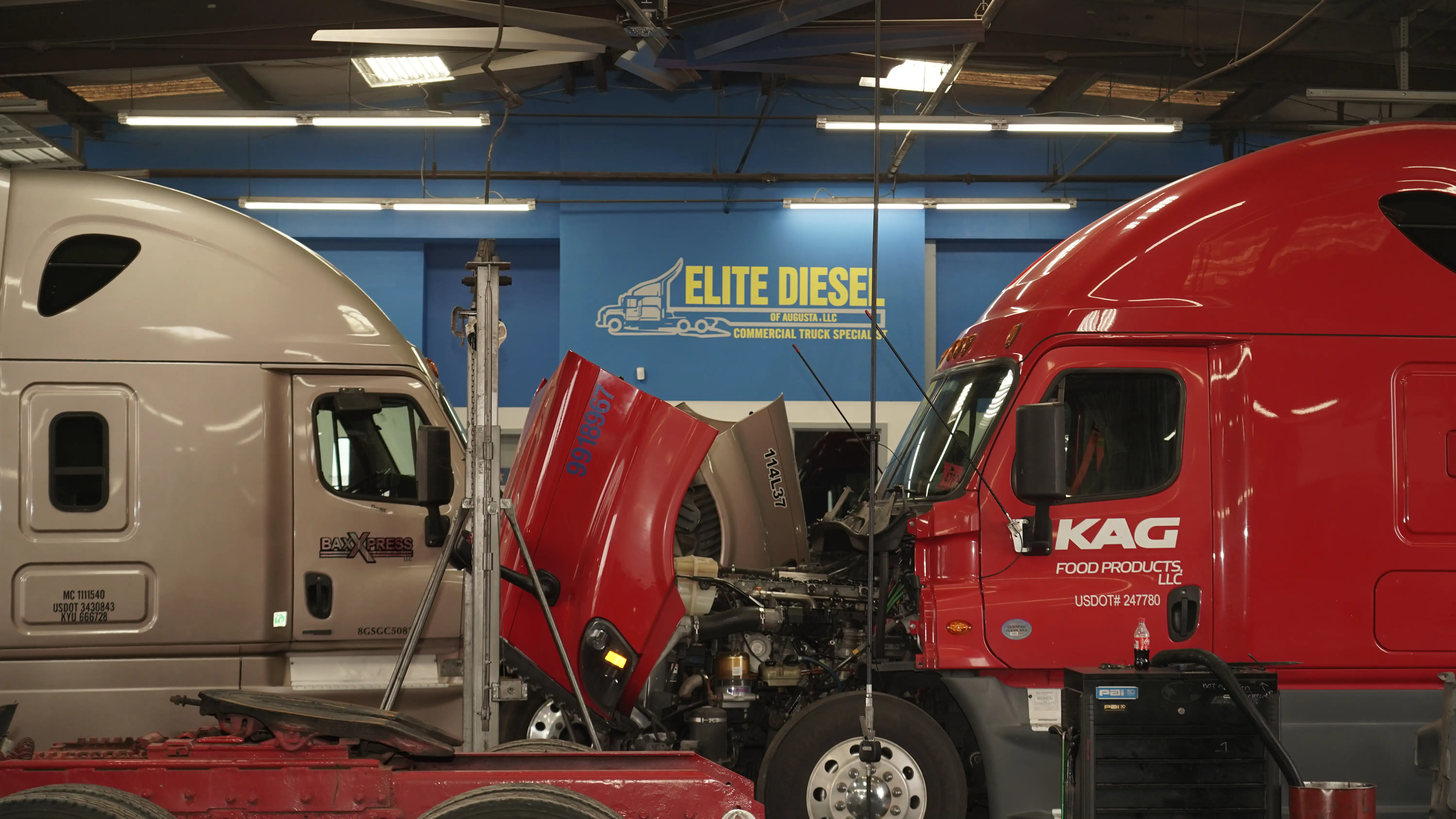 Red semi truck in for repairs