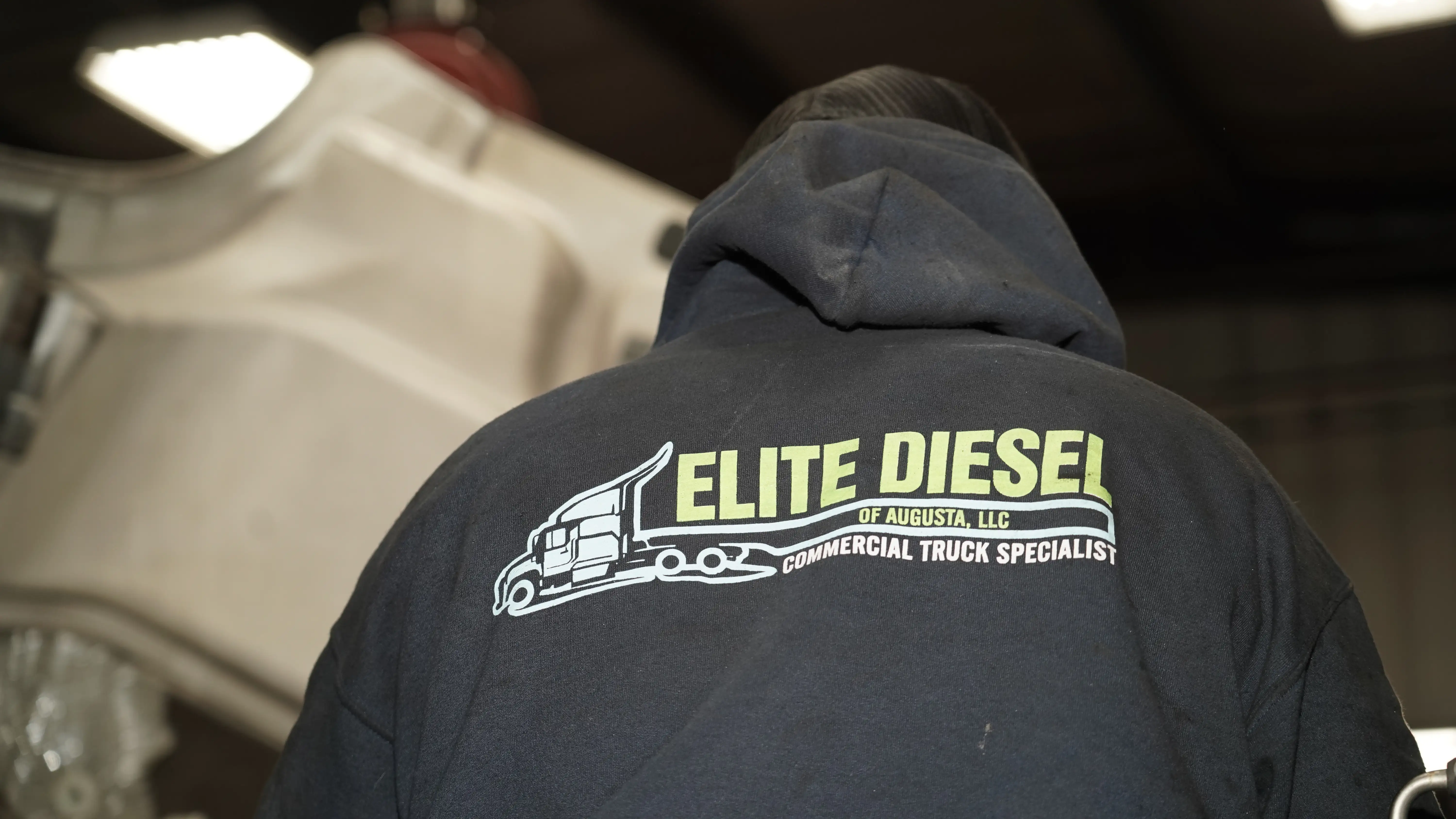 Diesel mechanic performing truck repairs